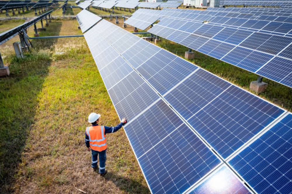 The solar farm(solar panel) with engineers check the operation of the system, Alternative energy to conserve the world's energy, Photovoltaic module idea for clean energy production.